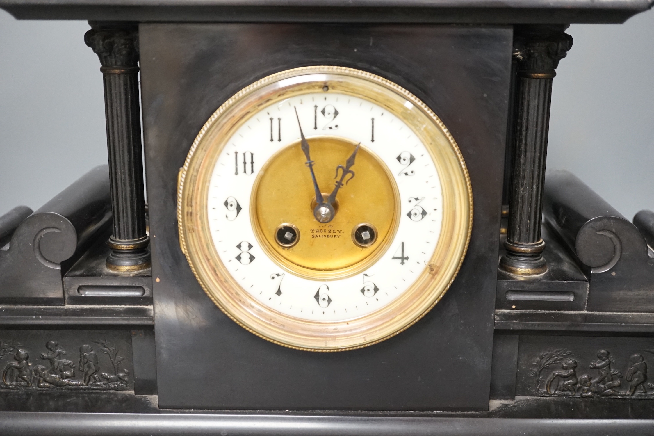 A large Victorian black slate mantel clock, with pendulum - 39cm high